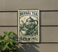 A sign for "Herbal Tea Brewing" is displayed on a wall, featuring an illustration of a teapot and a cup of tea surrounded by leaves.