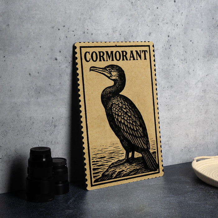 a framed illustration of a cormorant bird, which is a type of sea bird, sitting on a rock.