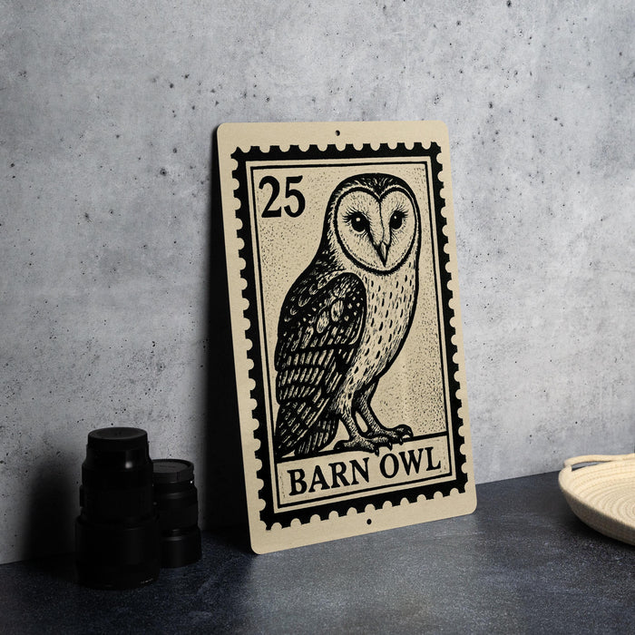 A metal sign featuring a barn owl illustration, with the text "BARN OWL" printed on it.