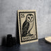 A metal sign featuring a barn owl illustration, with the text "BARN OWL" printed on it.