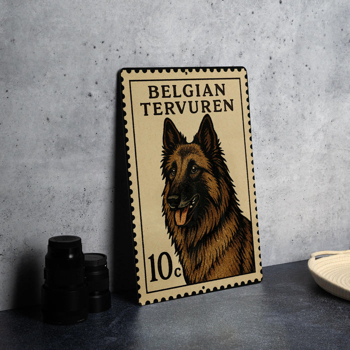 A metal frame with a postage stamp design featuring a brown and black dog, likely a German shepherd, on a gray background.