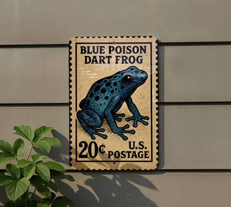 A postage stamp-like sign featuring a blue poison dart frog, mounted on a wall next to a plant.