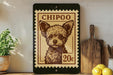 a small, wooden-framed picture of a dog, which appears to be a postage stamp. The stamp is placed on a shelf next to a wooden cutting board and a potted plant.