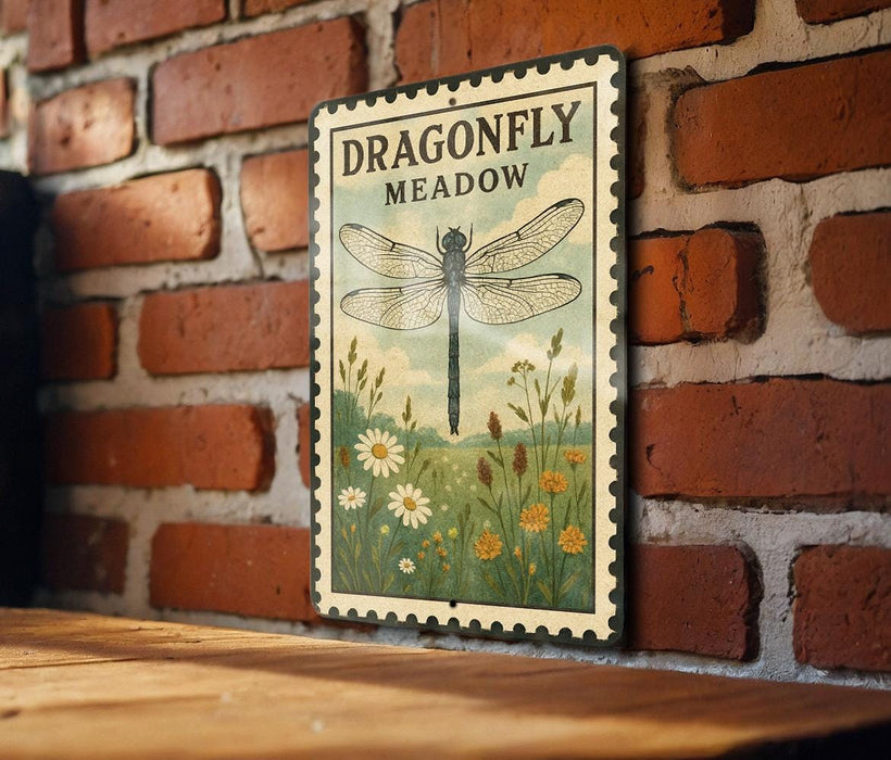 A vintage-style sign depicting a dragonfly meadow, mounted on a brick wall.