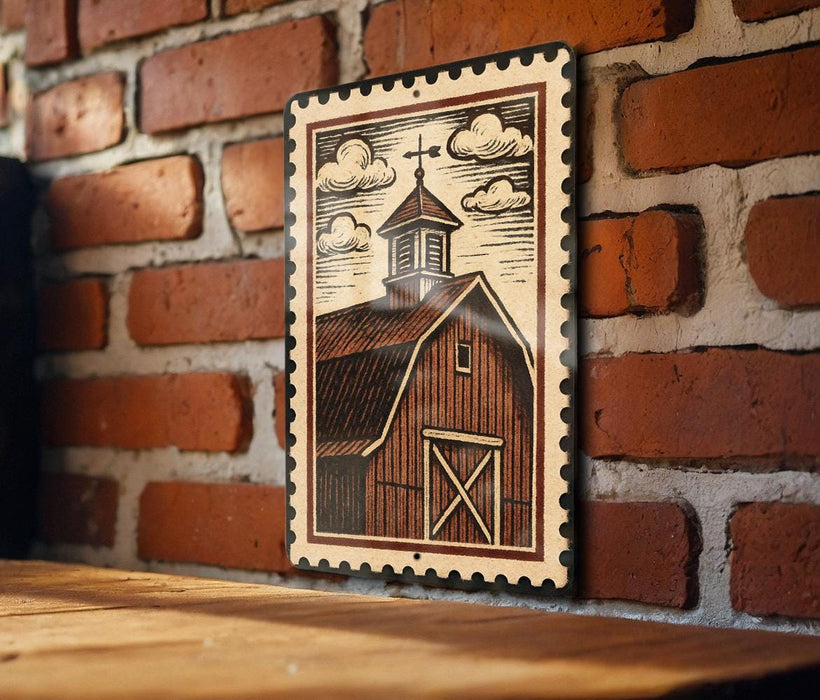 A wooden table with a framed illustration of a barn on a brick wall.