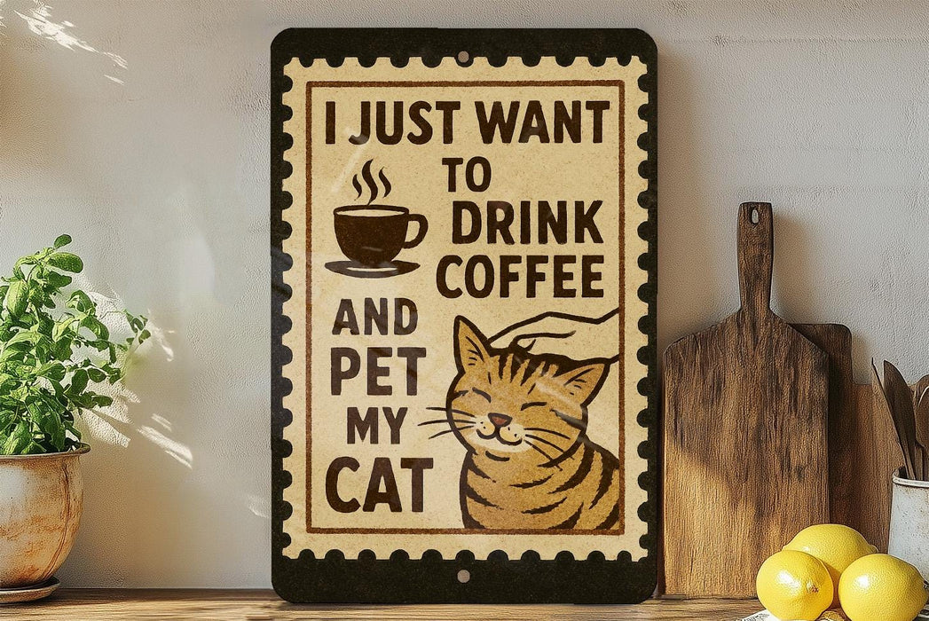 a sign with a cat and the text "I JUST WANT TO DRINK COFFEE AND PET MY CAT" displayed on a wall.