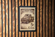 A 5c U.S. postage stamp featuring an illustration of an old pickup truck.