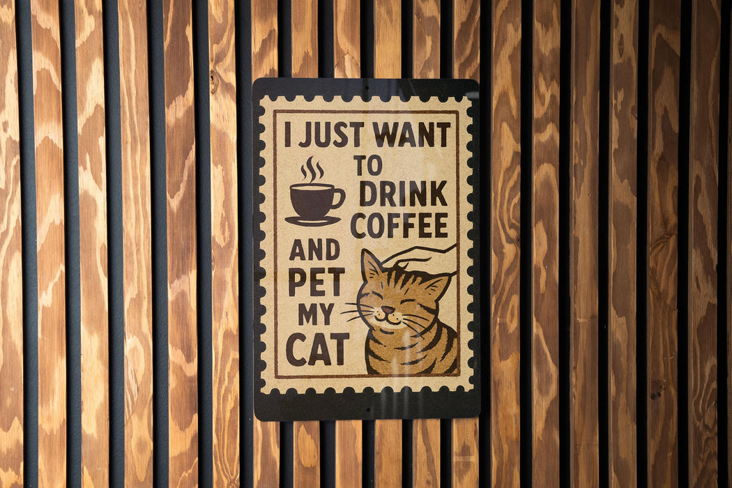 A sign with the text "I JUST WANT TO DRINK COFFEE AND PET MY CAT" is displayed on a wooden wall.