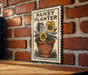 A vintage-style sign with the text "PANSY PLANTER" and an illustration of a potted plant with yellow and purple flowers.