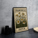 A metal stamp-like object with a floral design and the text "CHAMOMILE PATCH" printed on it, placed on a dark surface next to some black objects.