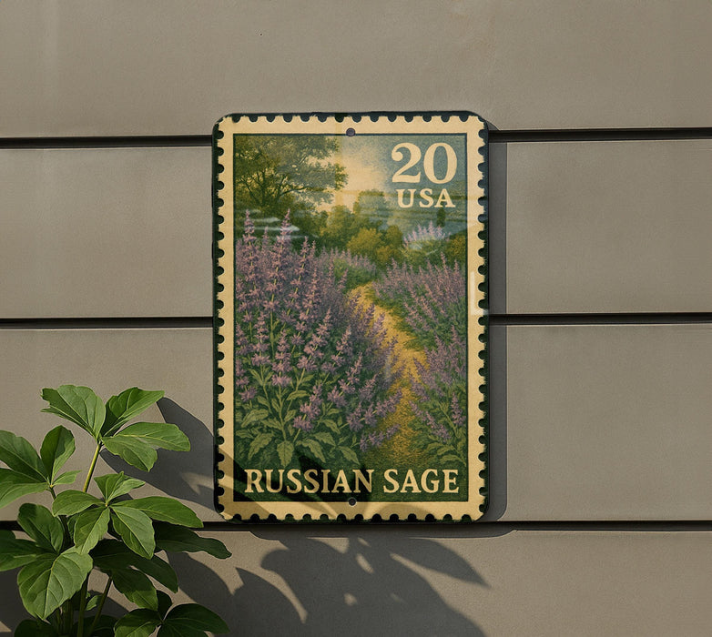 A postage stamp featuring a field of purple flowers, with the text "Russian Sage" printed on it. The stamp is mounted on a wall, and there is a plant next to it.