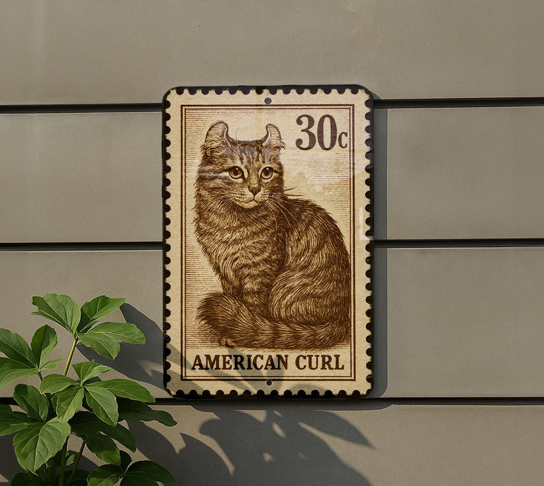 A metal sign featuring a cat illustration and the text "AMERICAN CURL" is mounted on a wall.