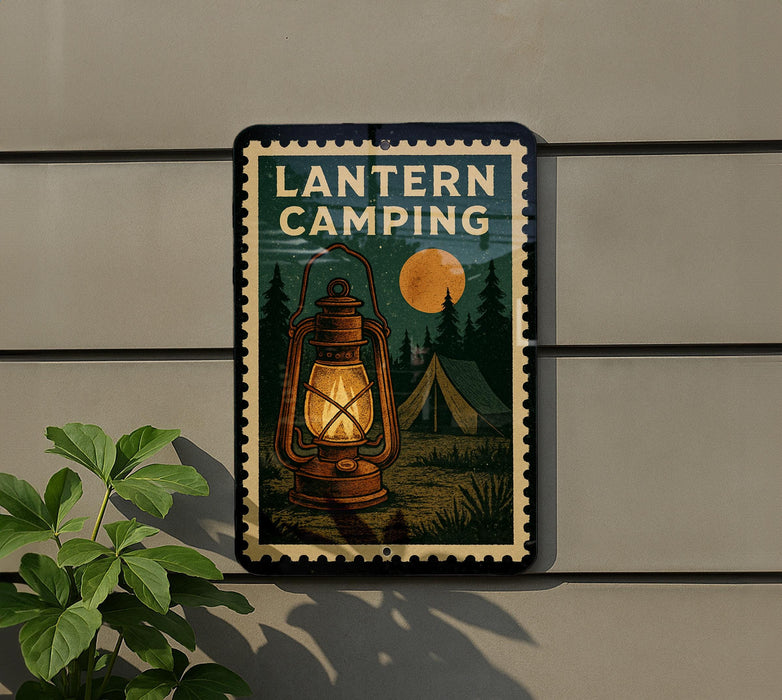 A lantern camping sign is displayed on a wall, with a plant to the left of the sign.