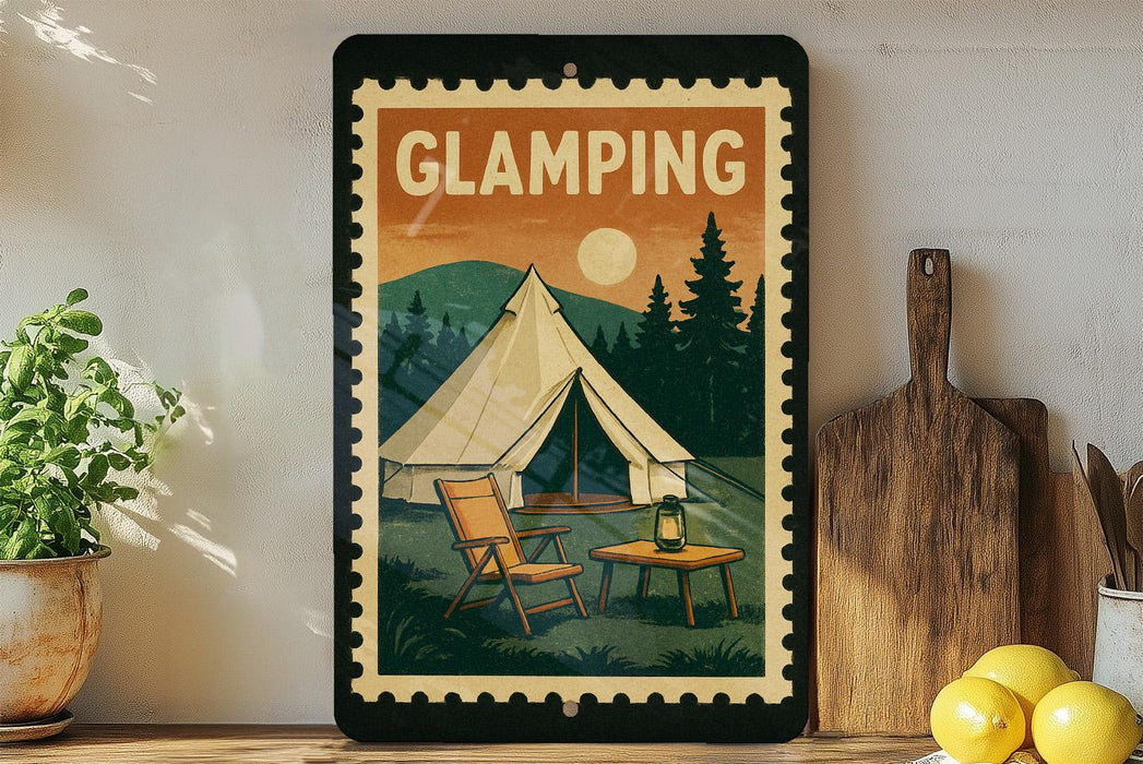 A framed vintage-style poster of a camping scene with a tent, chair, and table, along with a potted plant and wooden cutting board, is displayed on a wall.