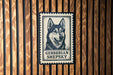 A black and white postage stamp featuring a close-up of a dog's face, with the text "GERBERIAN SHEPKY" below it.