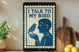 a framed poster with a blue bird and a man holding it, placed on a shelf next to a wooden cutting board and some lemons.