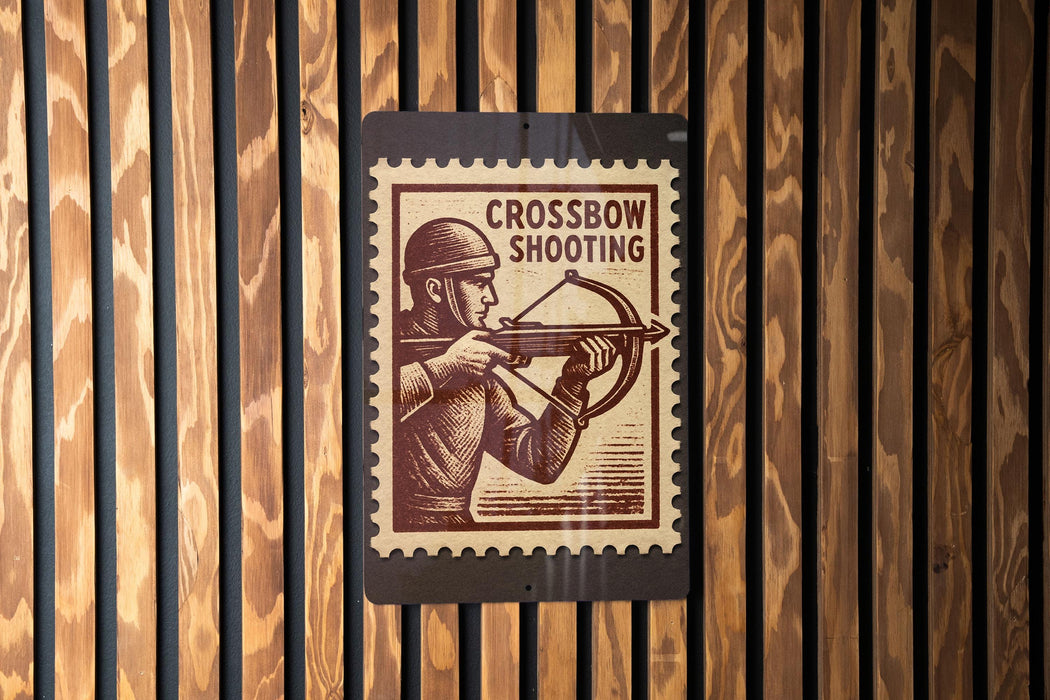 A sign with the text "CROSSBOW SHOOTING" and an illustration of a person holding a bow and arrow.
