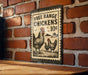 A sign advertising free range chickens for 10 cents is displayed on a brick wall.
