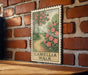 A vintage-style metal sign with a floral illustration and the text "CAMELIA WALK" is displayed on a brick wall.