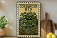 a decorative metal sign with a plant illustration, placed on a wooden surface next to a wooden cutting board and some lemons.