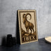 a metal sign with a printed illustration of a ram, and the word "IBEX" is written below the illustration.