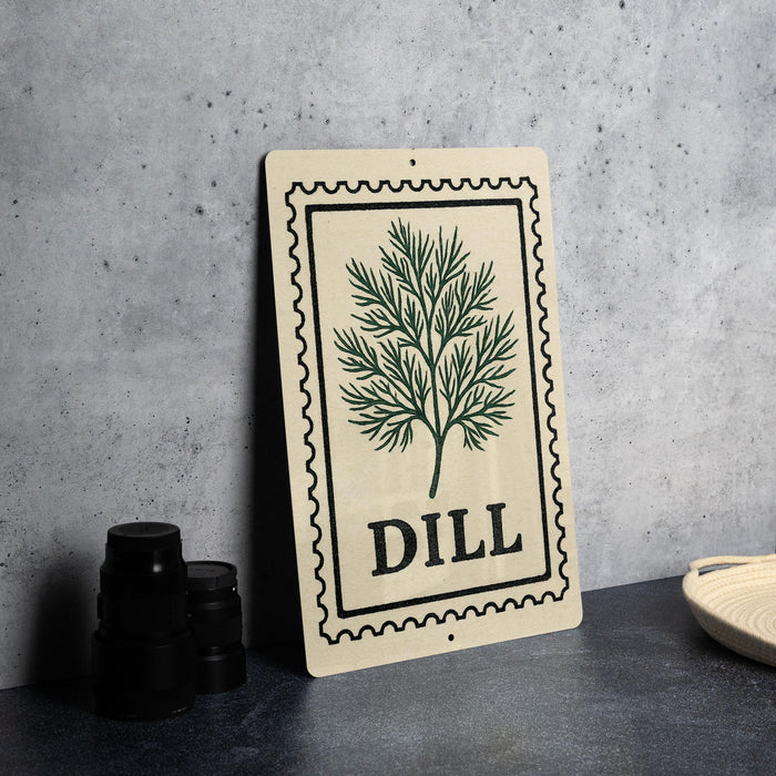 a decorative sign with a tree design and the word "DILL" printed on it, placed on a countertop next to some black containers.