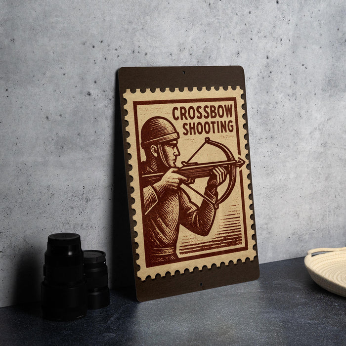 a brown wooden frame with a stamp-like design on it, depicting a man holding a crossbow.