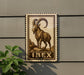 a large stamp-like sign with a depiction of a ram, mounted on a wall.