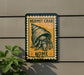 a sign with a crab illustration and the text "HERMIT CRAB HOME" on a wall.