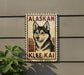 a sign with a picture of a dog, specifically a husky, and the text "ALASKAN KLEE KAI" on it.