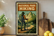 A vintage-style metal sign with a hiker illustration, mounted on a wall next to a wooden cutting board and some kitchen utensils.