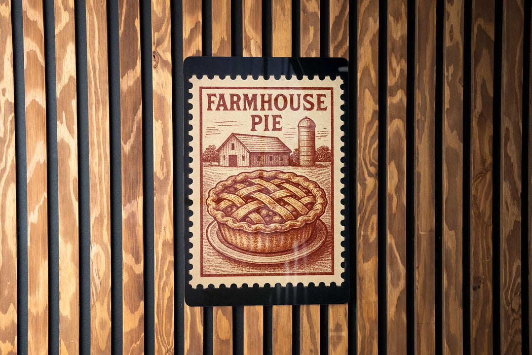 a wooden wall with a vintage-style stamp or sign that reads "FARMHOUSE PIE" and depicts a pie on a plate.