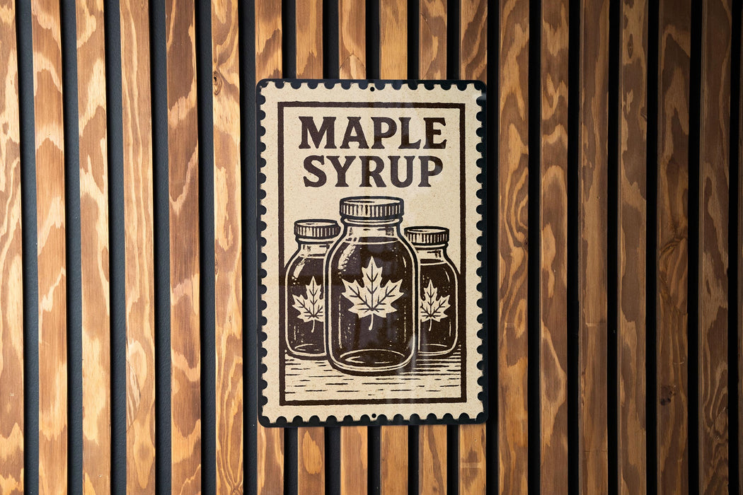 A sign with the text "MADE WITH MELONNA" and an illustration of three maple syrup bottles is displayed on a wooden wall.