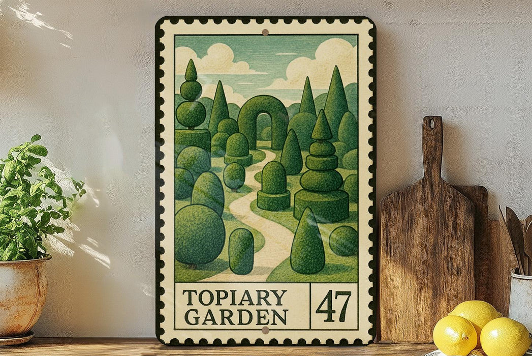 A framed illustration of a topiary garden, featuring a winding path surrounded by lush, meticulously trimmed hedges. The garden is depicted in a whimsical, artistic style, with a variety of green trees and bushes. The frame has a vintage or antique appearance, and the text "TOPIARY GARDEN" is visible, indicating the subject of the artwork.