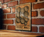 a wooden sign with a circular design on it, mounted on a brick wall.