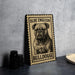 A metal sign featuring a bulldog illustration, with the text "Olde English Bulldogge" printed on it.
