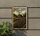 A metal sign with a farm scene and a barn, mounted on a wall next to a plant.