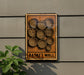 a wooden sign with a design of circles and a flower, mounted on a wall.