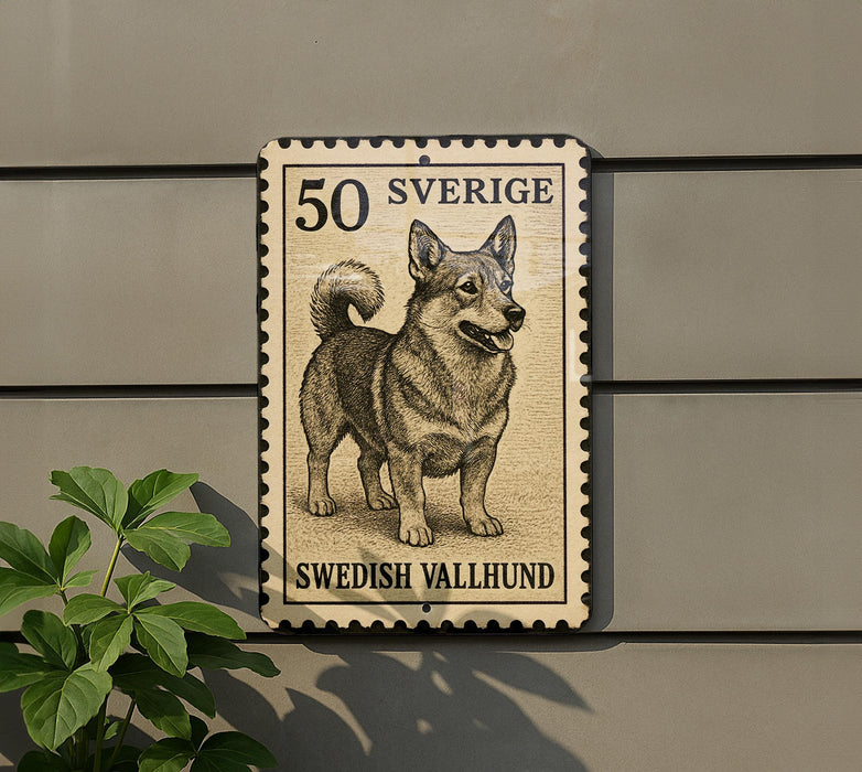 A 50 Swedish Vallhund dog stamp is displayed on a wall, with a plant visible to the left.