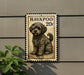A metal sign with a dog illustration on it, mounted on a wall.