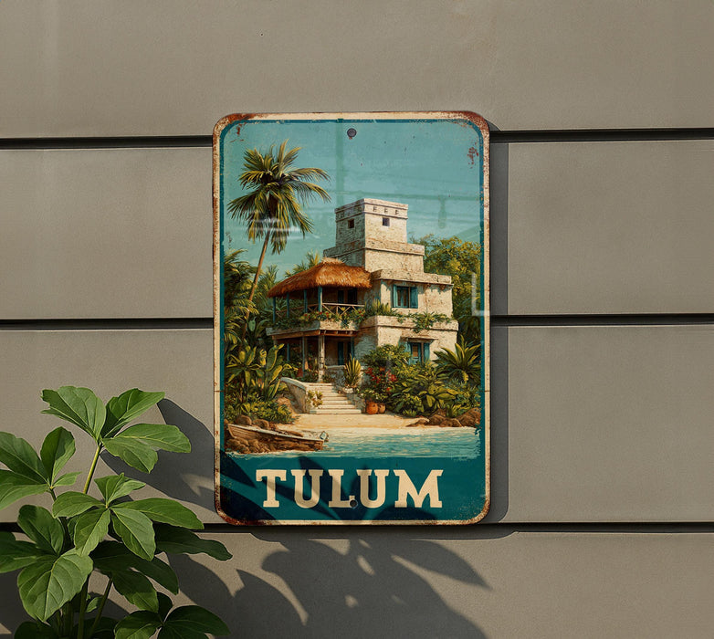 A vintage-style metal sign with a tropical beach scene and a building, mounted on a wall.