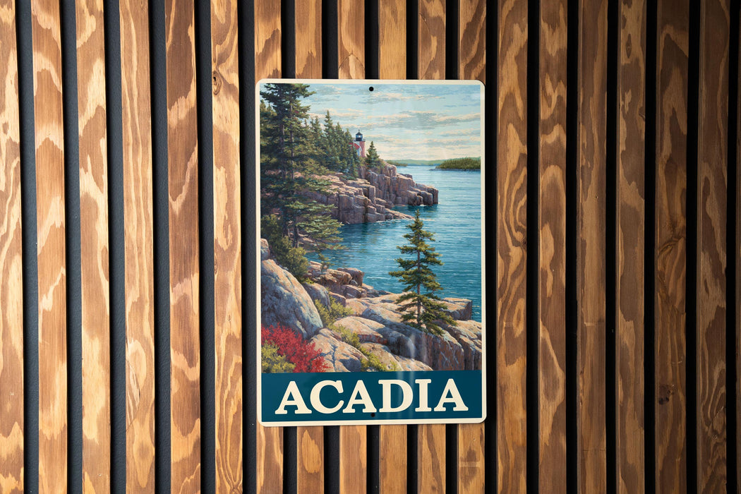 A vintage-style metal sign with a scenic image of a rocky coastline and a lighthouse, mounted on a wooden wall.