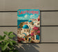A vintage-style poster of Santorini, Greece, featuring colorful buildings, blue domes, and a scenic view of the Mediterranean Sea.