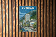 A vintage-style poster of Juneau, the capital city of the state of Montana, Canada, featuring a mountain backdrop and a street scene with cars.