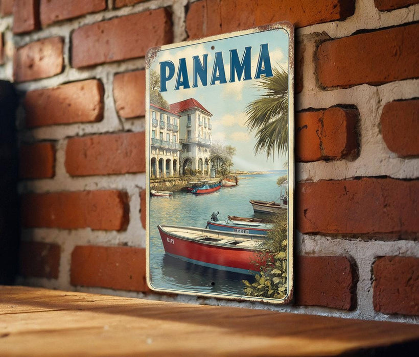 A vintage-style metal sign with the word "PANAMA" prominently displayed, featuring a scenic image of boats on a body of water with a brick wall in the background.