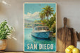 A vintage-style metal sign with a painting of a boat on a body of water, surrounded by palm trees, with the text "SAN DIEGO" prominently displayed.