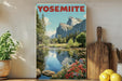 A framed poster of Yosemite National Park, featuring a scenic landscape with mountains, trees, and a river with flowers.