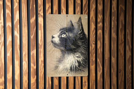 A black and white portrait of a cat is displayed on a wooden wall, with vertical slats creating a textured background.