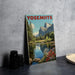 A framed photograph of a scenic landscape with mountains, trees, and a river, with the word "YOSEMITE" prominently displayed.