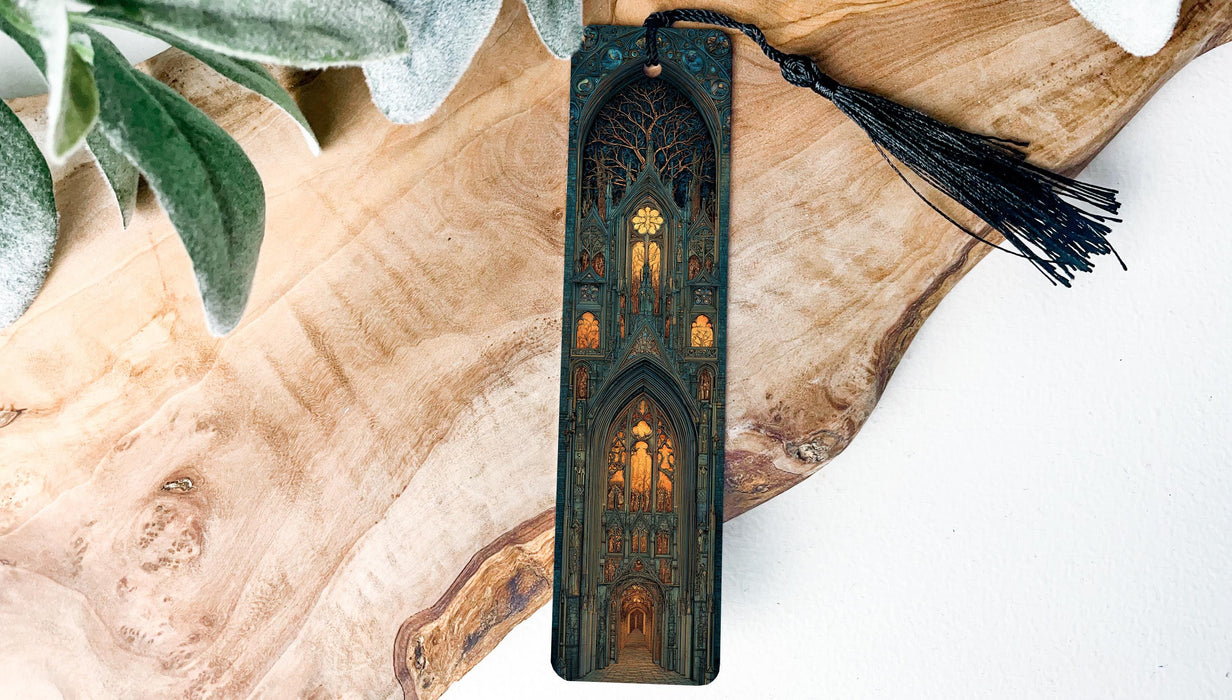 A wooden bookmark with an intricate design of a cathedral or church, featuring stained glass windows and a tassel.